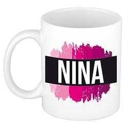 Foto van Naam cadeau mok / beker nina met roze verfstrepen 300 ml - naam mokken