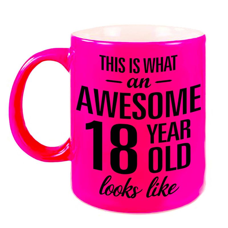 Foto van Awesome 18 year cadeau mok / beker neon roze 330 ml - feest mokken