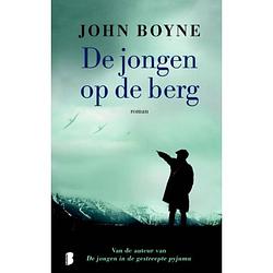 Foto van De jongen op de berg