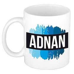 Foto van Naam cadeau mok / beker adnan met blauwe verfstrepen 300 ml - naam mokken