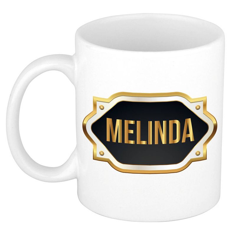 Foto van Naam cadeau mok / beker melinda met gouden embleem 300 ml - naam mokken