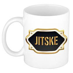 Foto van Naam cadeau mok / beker jitske met gouden embleem 300 ml - naam mokken