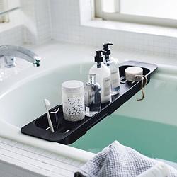 Foto van Yamazaki extendable bathtub tray - tower - black