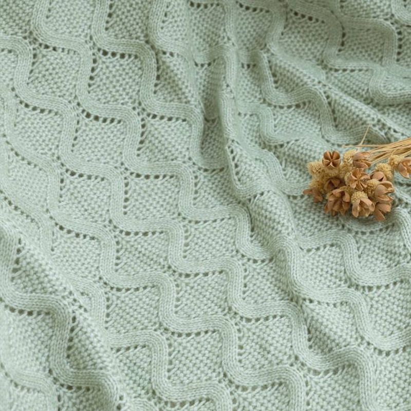 Foto van Amelie home - diamond pointelle gebreide deken - salie groen