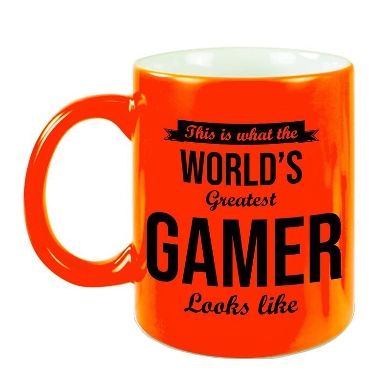 Foto van Worlds greatest gamer cadeau koffiemok / theebeker neon oranje 330 ml - feest mokken