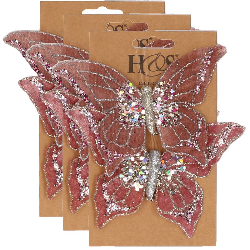 Foto van 6x stuks kunststof decoratie vlinders op clip roze 10 x 15 cm - kunstbloemen