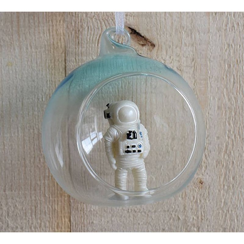 Foto van Glass ball with spaceman inside