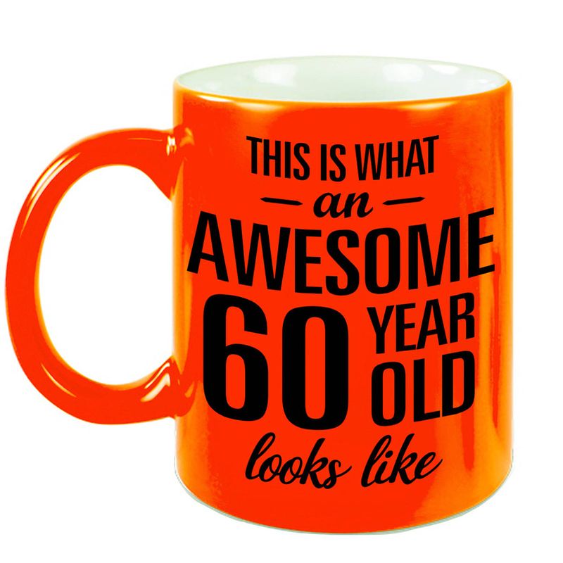 Foto van Awesome 60 year cadeau mok / beker neon oranje 330 ml - feest mokken