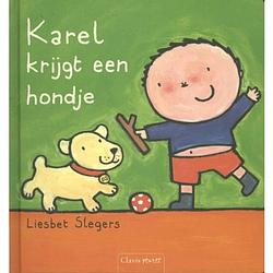 Foto van Karel krijgt een hondje