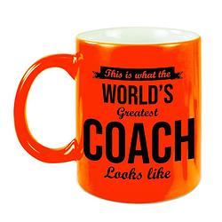 Foto van Worlds greatest coach cadeau koffiemok/theebeker neon oranje 330 ml - feest mokken