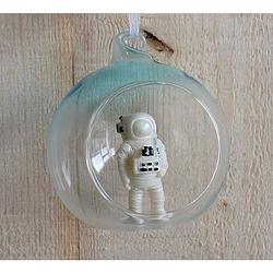 Foto van Glass ball with spaceman inside