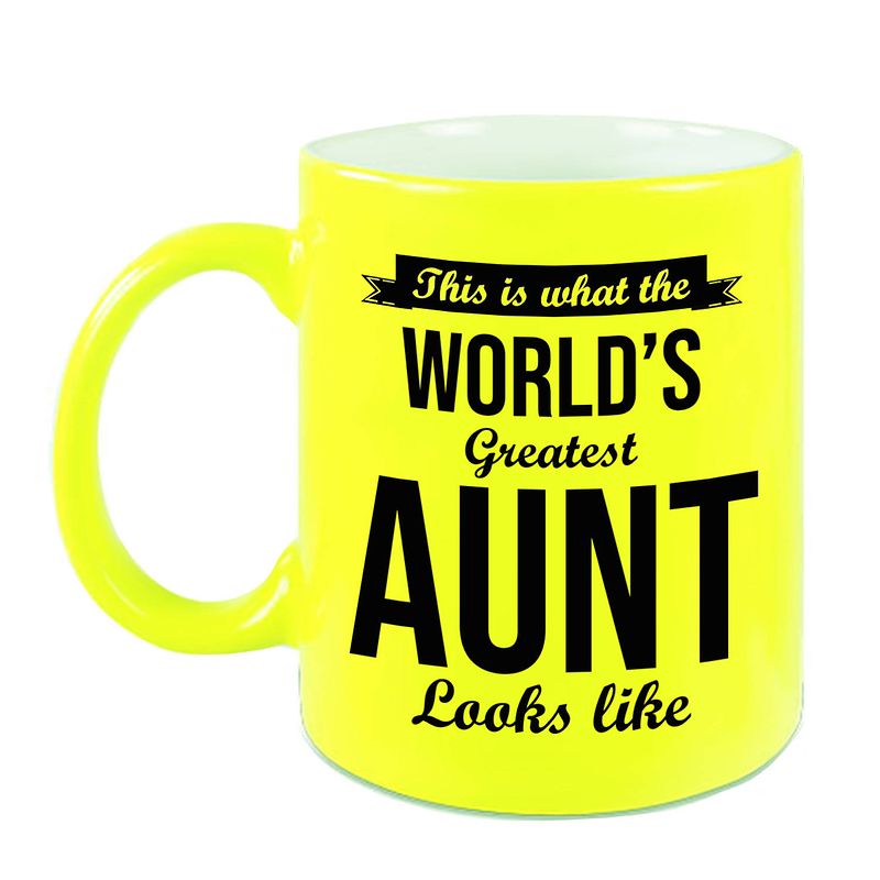 Foto van Worlds greatest aunt / tante cadeau koffiemok / theebeker neon geel 330 ml - feest mokken