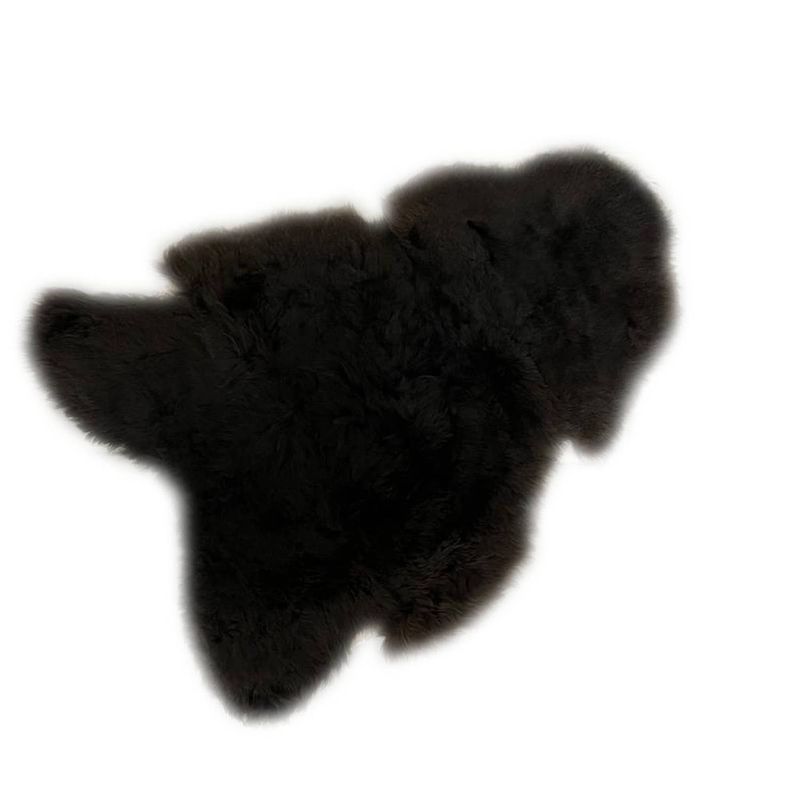 Foto van Ptmd furry black shaped sheepskin plaid