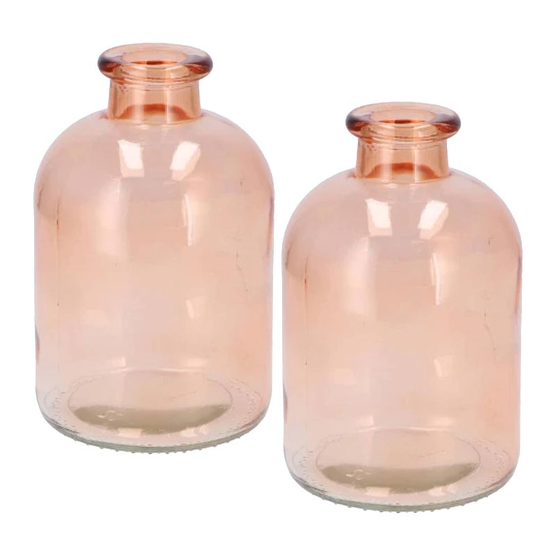 Foto van Dk design bloemenvaas fles model - 2x - helder gekleurd glas - perzik roze - d11 x h17 cm - vazen