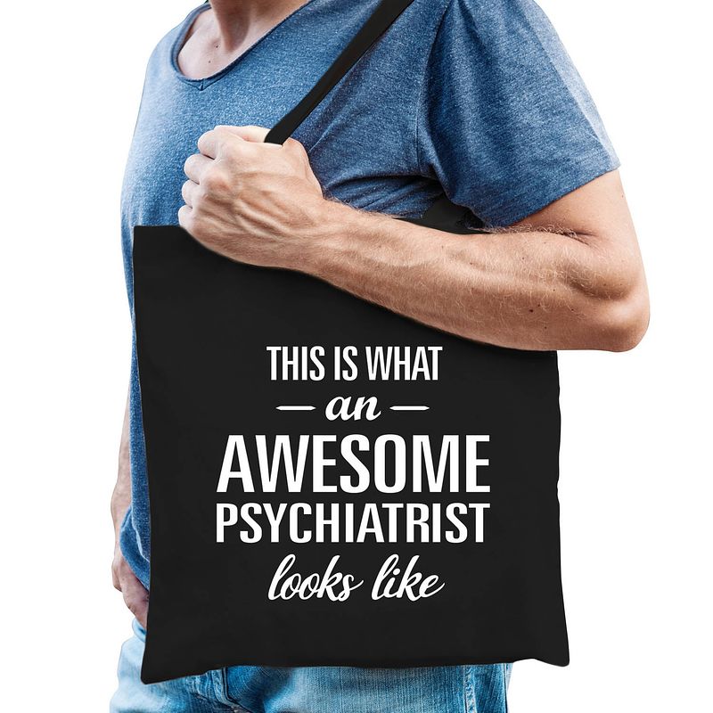 Foto van Awesome psychiatrist / geweldige psychiater cadeau tas zwart voor dames en heren - feest boodschappentassen