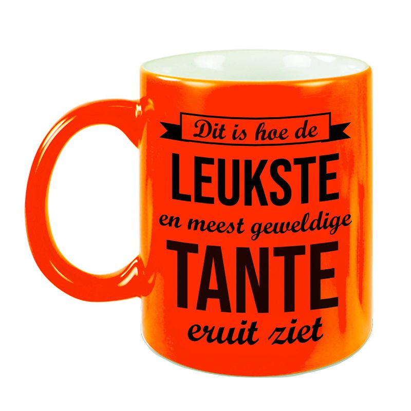 Foto van Leukste en meest geweldige tante cadeau koffiemok / theebeker neon oranje 330 ml - feest mokken