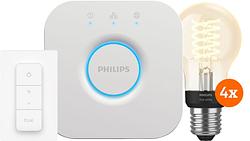 Foto van Philips hue filament white globe e27 4-pack startpakket