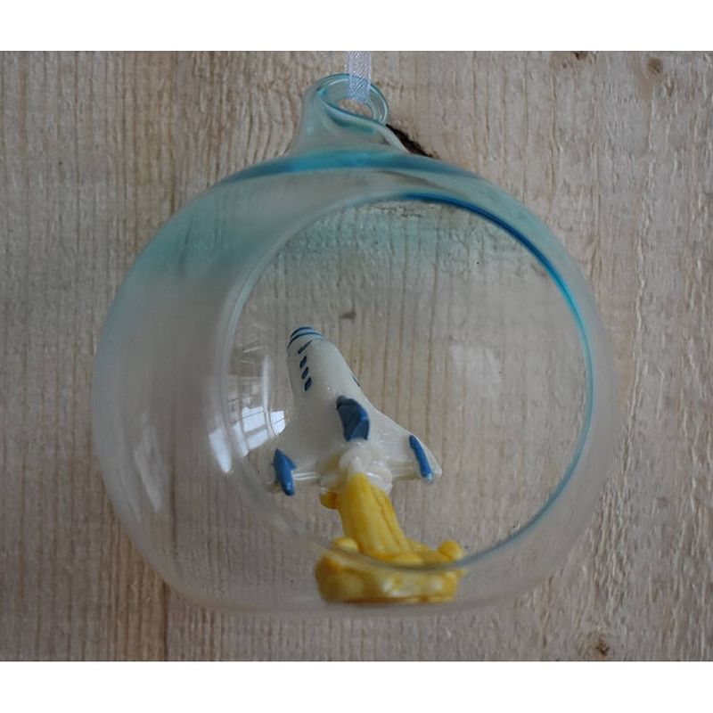 Foto van Glass ball with rocket inside