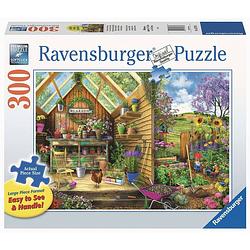 Foto van Ravensburger eavensburger puzzel blik in het tuinhuis