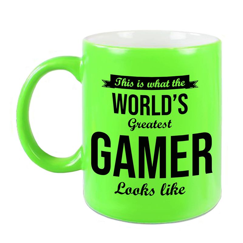 Foto van Worlds greatest gamer cadeau koffiemok / theebeker neon groen 330 ml - feest mokken