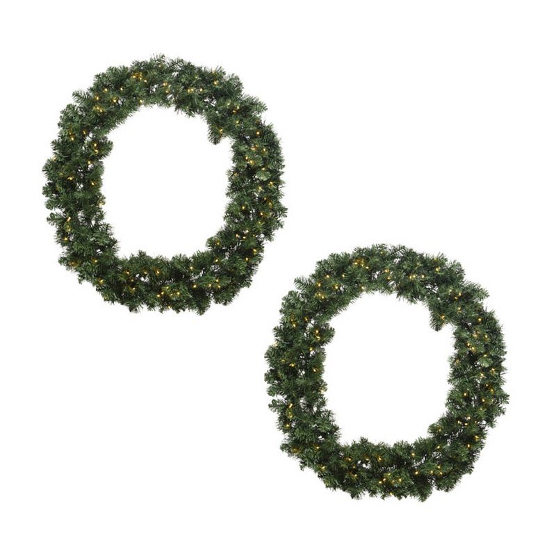 Foto van Set van 2x stuks kerstkransen/dennenkransen groen met warm witte verlichting en timer 60 cm - kerstkransen