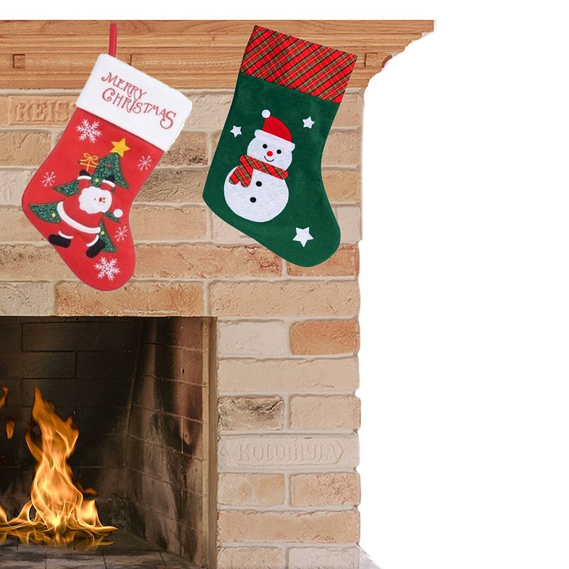 Foto van Set van 2x stuks kerstsokken h40 en h45 cm met kerstman en sneeuwpop - kerstsokken
