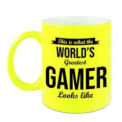 Foto van Worlds greatest gamer cadeau koffiemok / theebeker neon geel 330 ml - feest mokken